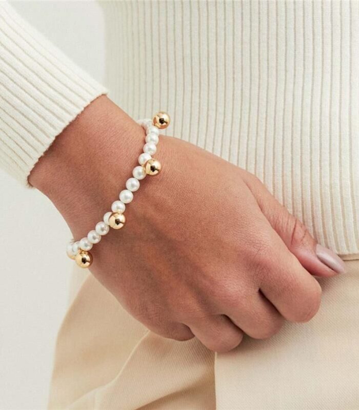 Pulseira em Pérola Shell e Esfera Banhada a Ouro